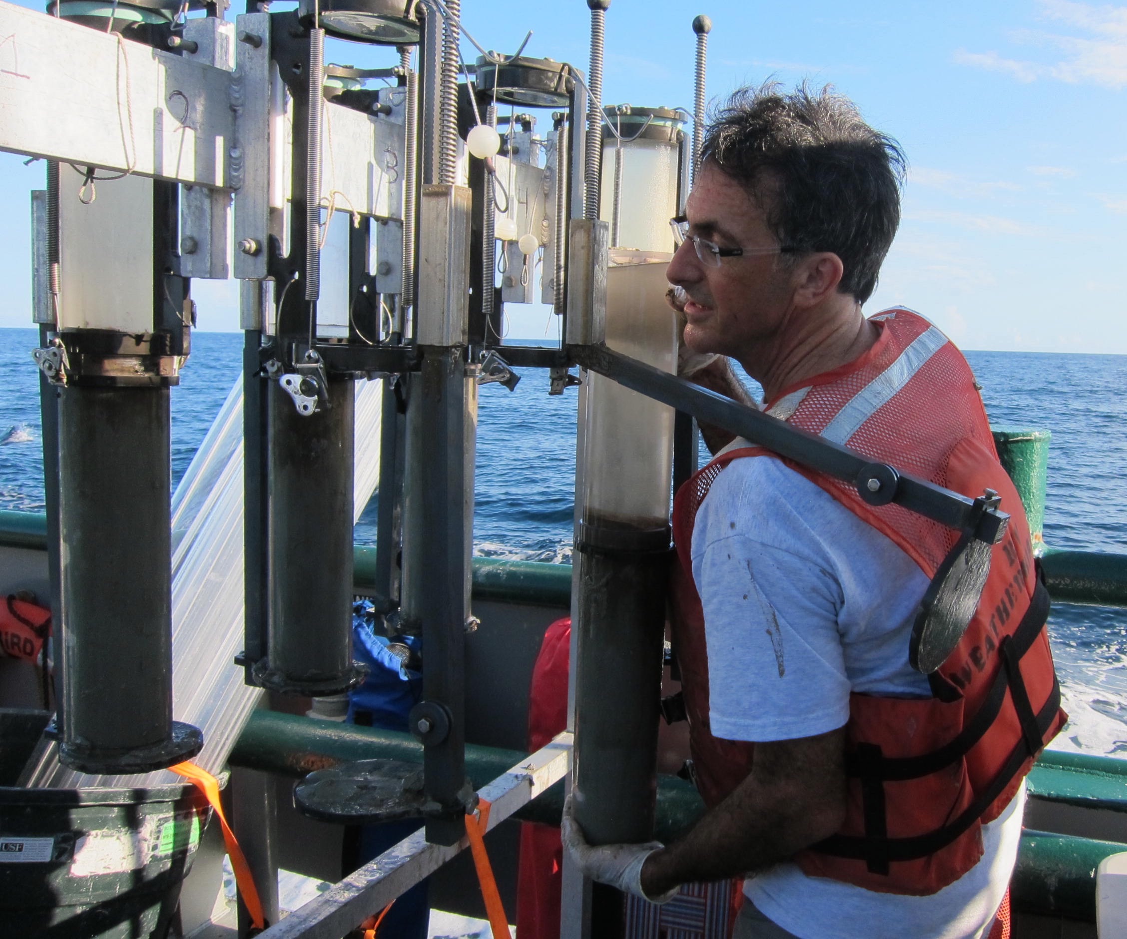 David Hastings removes a sediment core for processing and later analysis.
