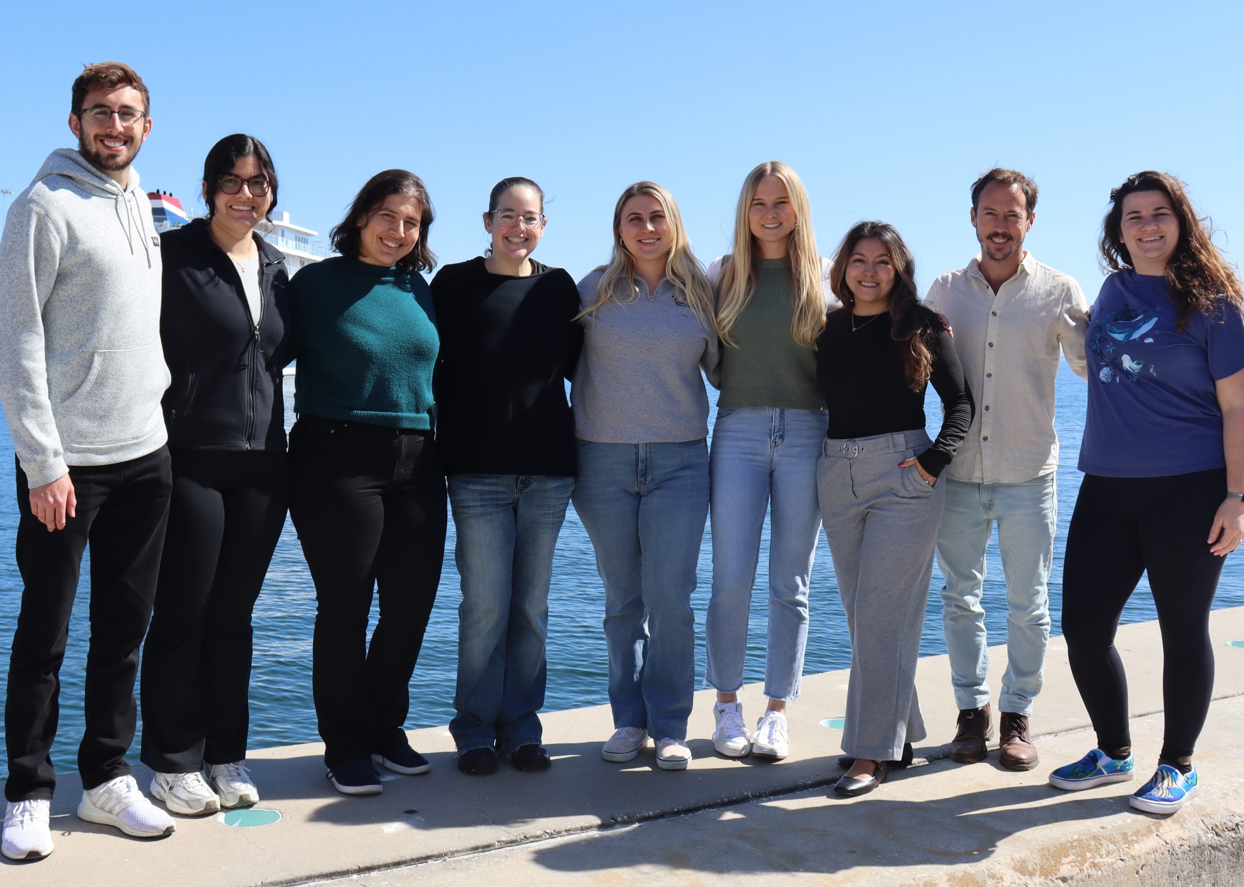 Breitbart lab standing in front of the water