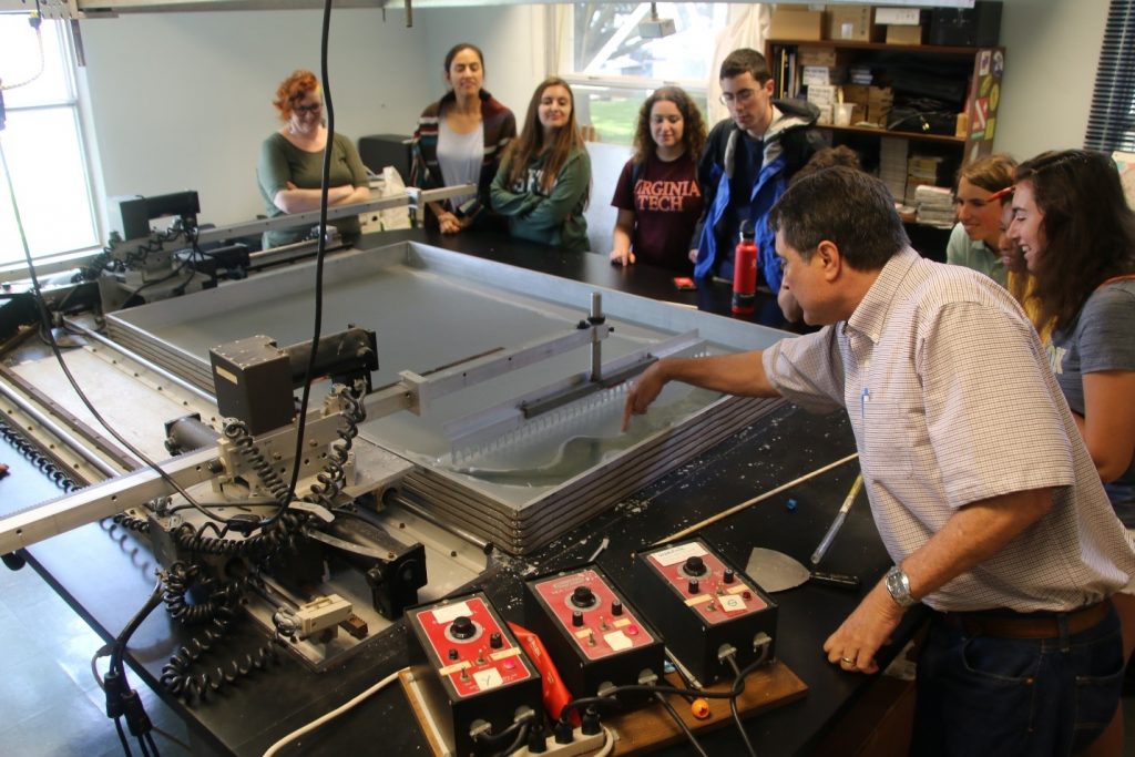 David Naar operated the wax model demo device and points out a widening gap in the surface, analogous to the rifting that occurs at mid-ocean ridges