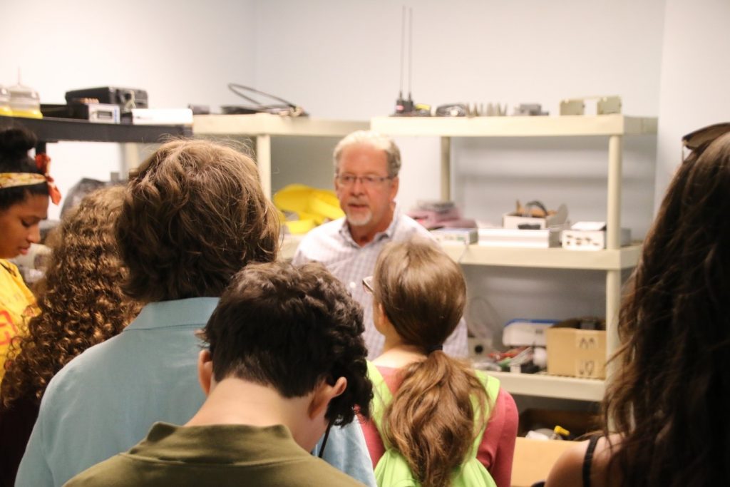Physical oceanographer Dr. Mark Luther does a show-and-tell of ocean-sensing equipment for the REU students