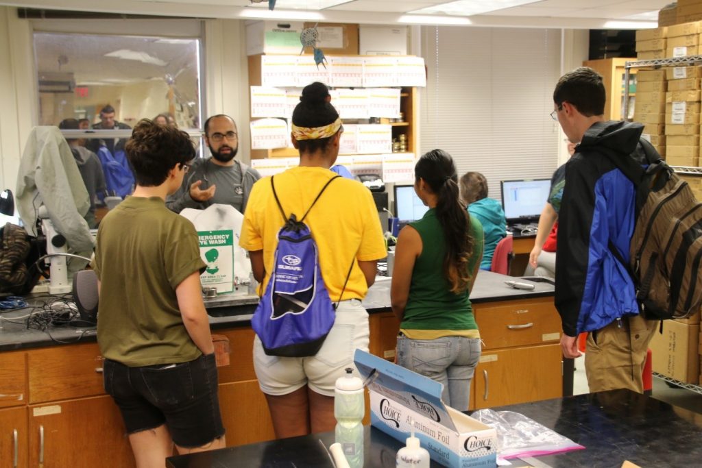 Bryan O’Malley, a senior technician in the Paleo Lab, explains to the visiting REU students how sediment cores are handled in the lab and what we can learn about paleoclimates by analyzing fossils within the cores