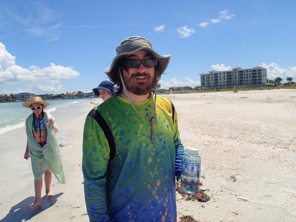 Camp mentor and USFCMS graduate student, Benjamin Ross, preparing to instruct campers on the flora and fauna of Shell Key.