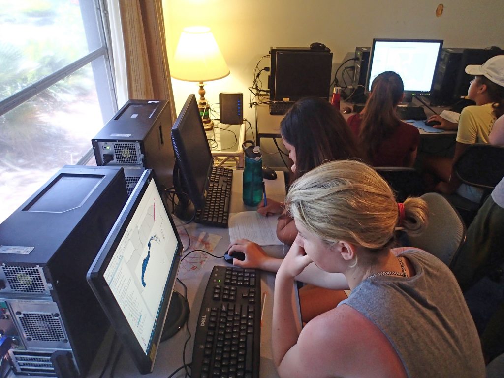 Campers utilizing ArcGIS mapping software to choose best locations to place a Marine Protected Area. Photo credit: OCG Staff