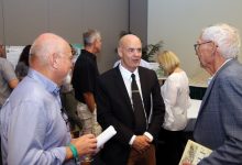 Author Jack Davis (center) talks with guests before giving a talk on his Pulitzer Prize-winning book. USFCMS professor Steve Murawski (left) waits to ask Dr. Davis a question.