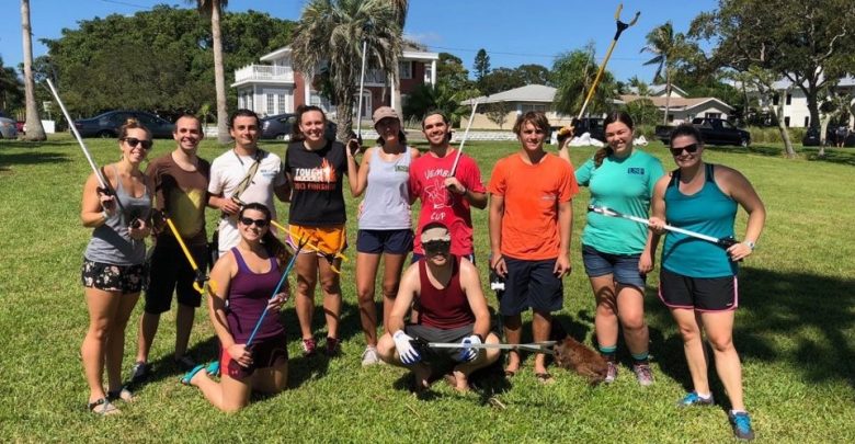 College of Marine Science students pose with trash pickers after a long day’s work