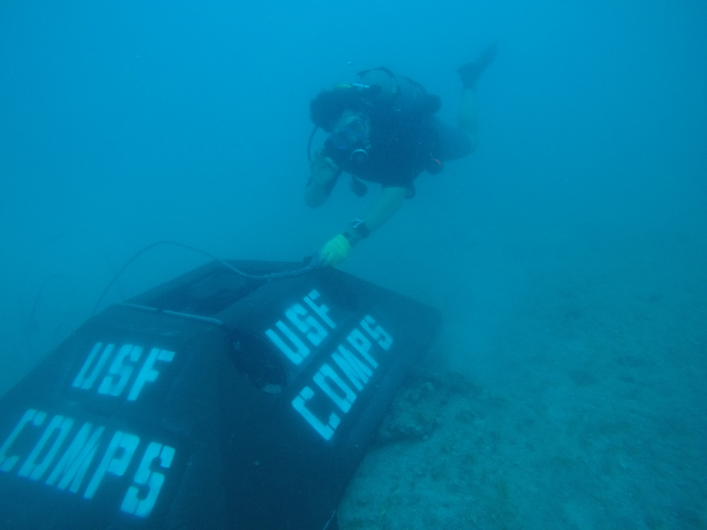 ben-meister-detaching-lifting-harness-from-adcp-bottom-mount-in-rebecca-shoals