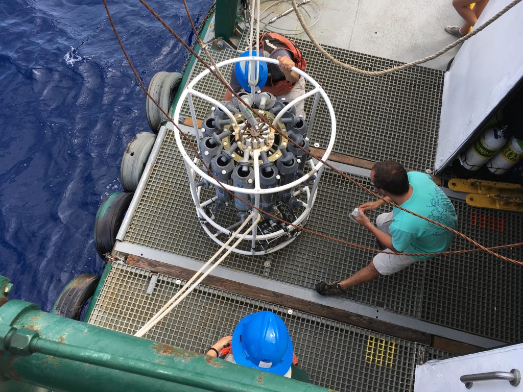 luis-sorinas-morales-examining-niskin-bottles-on-ctd-ahead-of-water-sampling