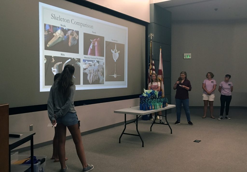 Campers describe the differences between manatees and dolphins during this year’s final presentations for the Oceanography Camp for Girls. Campers describe the differences between manatees and dolphins during this year’s final presentations for the Oceanography Camp for Girls.