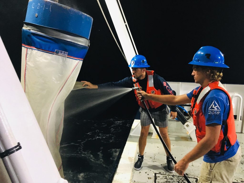 Garrett Miller (foreground) and Ian Williams retrieve and hose down the Bongo nets at the last station on one of their noon to midnight shifts. Garrett Miller (foreground) and Ian Williams retrieve and hose down the Bongo nets at the last station on one of their noon to midnight shifts.