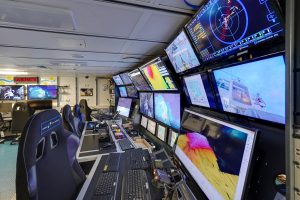 The Control Room on the Falkor, from which pilots operate the ROV SuBastianas guided by a team of scientists. The Control Room on the Falkor, from which pilots operate the ROV SuBastianas guided by a team of scientists.